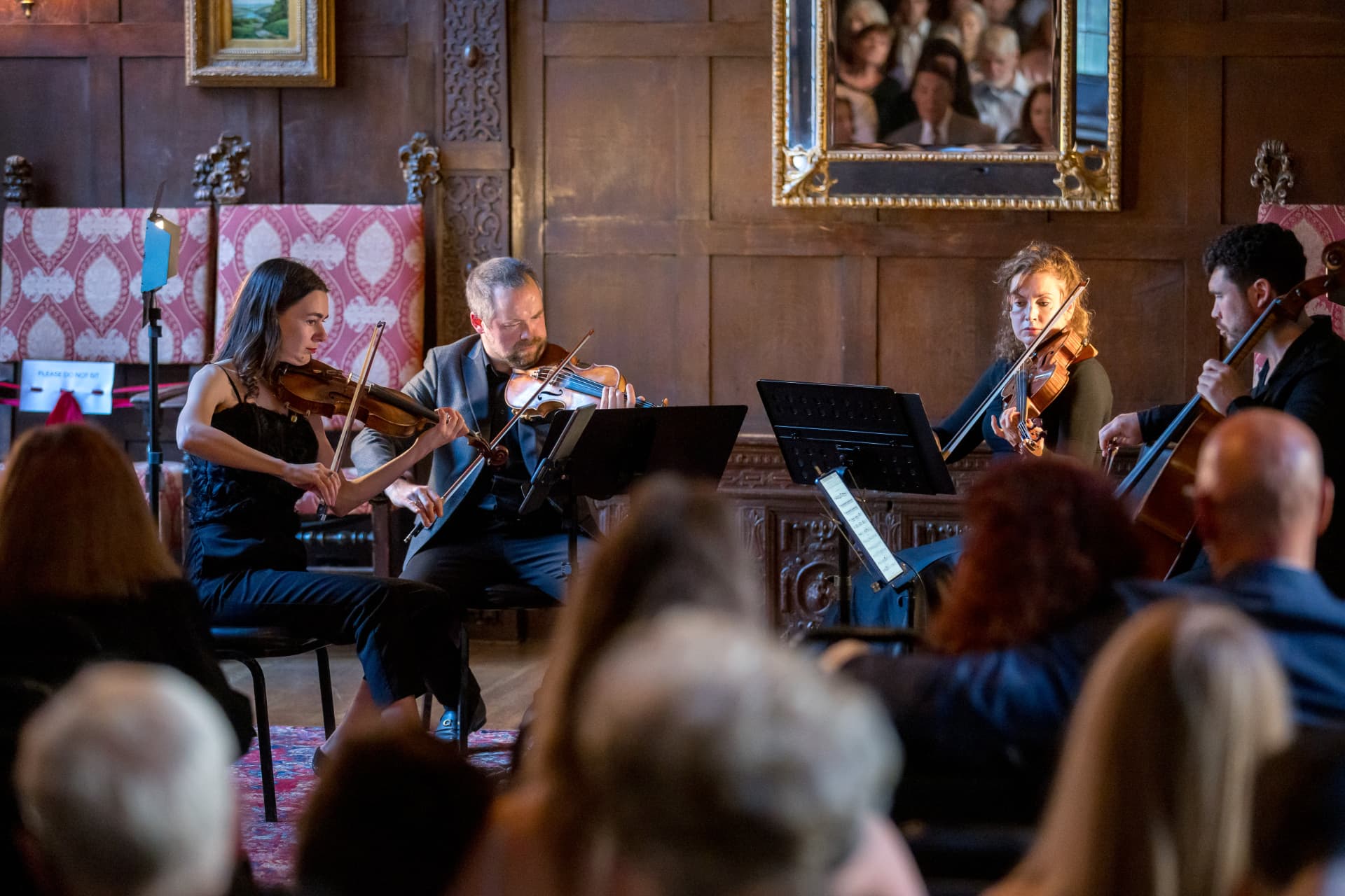 Chamber musicians performing before an audience